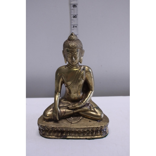 271 - A brass figure of a seated Budda