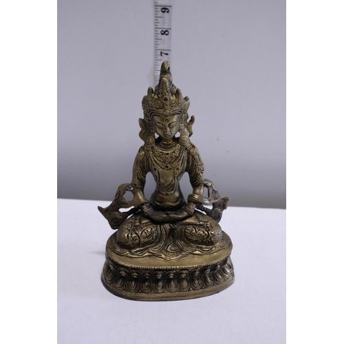 273 - A brass figure of a seated Budda