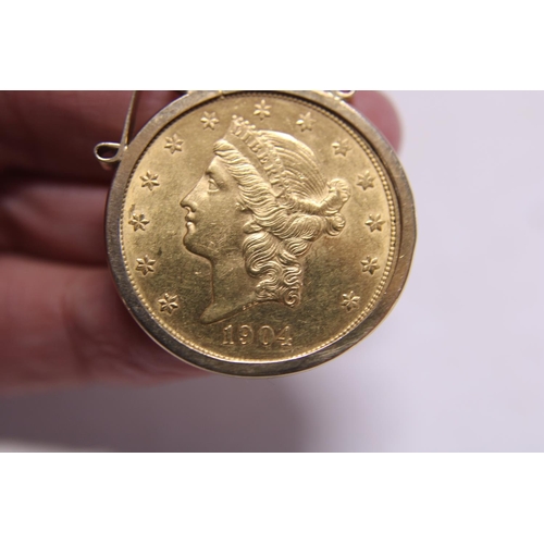 113 - A 1904 American 22ct gold twenty dollar coin in with double eagle and liberty head set in a 9ct gold... 