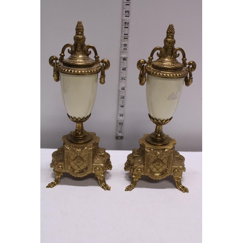 210 - A gilt brass mantle clock with two garnitures, movement by Franz Hermle. Shipping unavailable