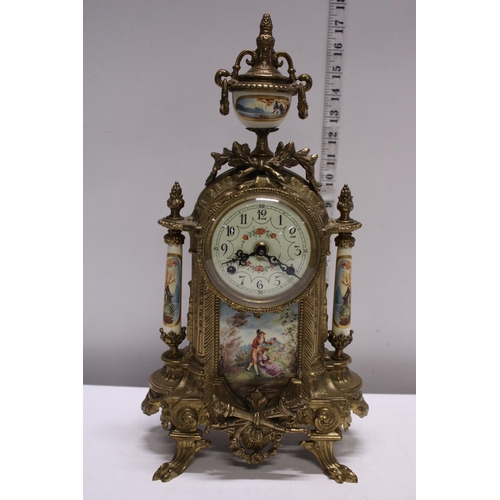 210 - A gilt brass mantle clock with two garnitures, movement by Franz Hermle. Shipping unavailable