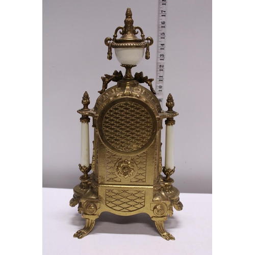 210 - A gilt brass mantle clock with two garnitures, movement by Franz Hermle. Shipping unavailable