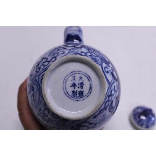 83 - A Chinese porcelain dragon form blue and white teapot with character marks to the base