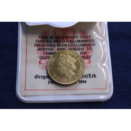 223 - A 9ct gold commemorative coin 2.56g