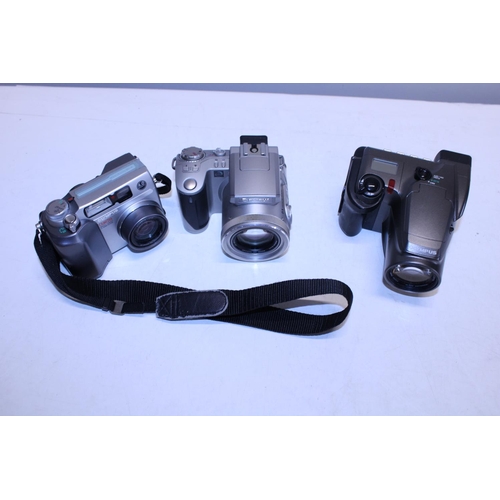 308 - Three assorted Olympus cameras (untested)