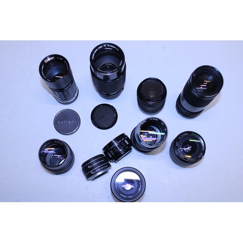 310 - A job lot of assorted camera lenses including Canon etc