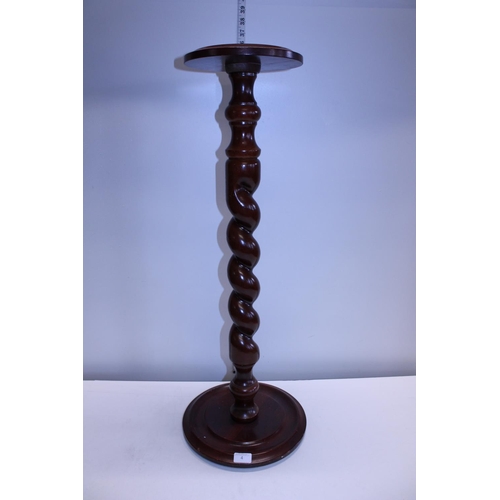 4 - A mahogany barley twist planter stand, h85cm shipping unavailable