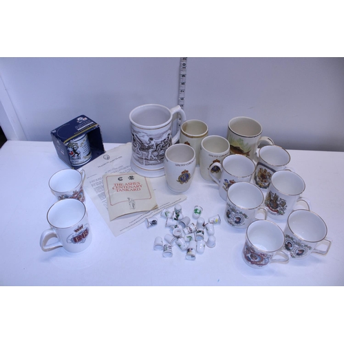 45 - A job lot of assorted commemorative ware mugs and other