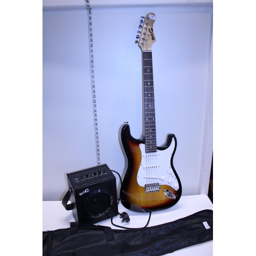 65 - A cased Rock Jam electric guitar and small amp, shipping unavailable