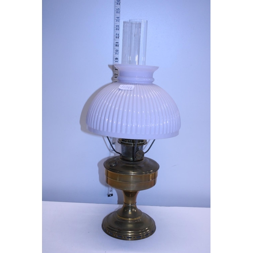 172 - A antique brass oil lamp with opaque glass shade and chimney shipping unavailable