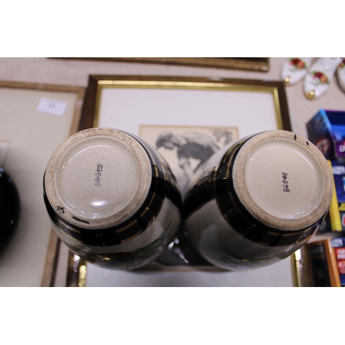 62 - A pair of Japanese vases signed to the base