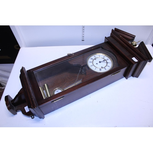 69 - A large wall mounted Viennese style clock. No postage