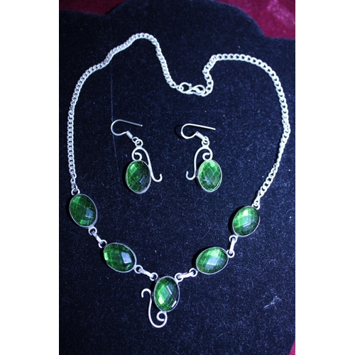 282 - A 925 silver necklace and earring set with green stones