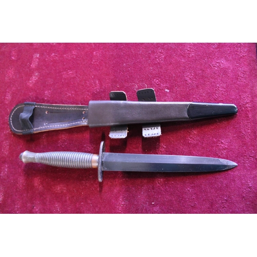 284 - A Fairbairn Sykes pattern 3 commando fighting knife, No 3 to pommel (WW2 issue) and scabbard