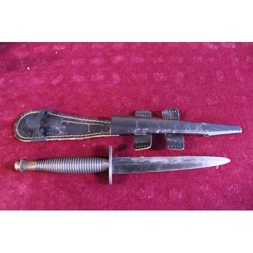 288 - A Fairbairn Sykes commando fighting knife pattern 3, No 1 to pommel (WW2 issue) and scabbard