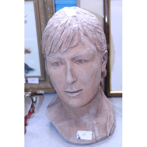 61 - A Terracotta bust of a young woman 34cm