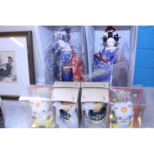 67 - Two boxed Japanese dolls and four Japanese figures