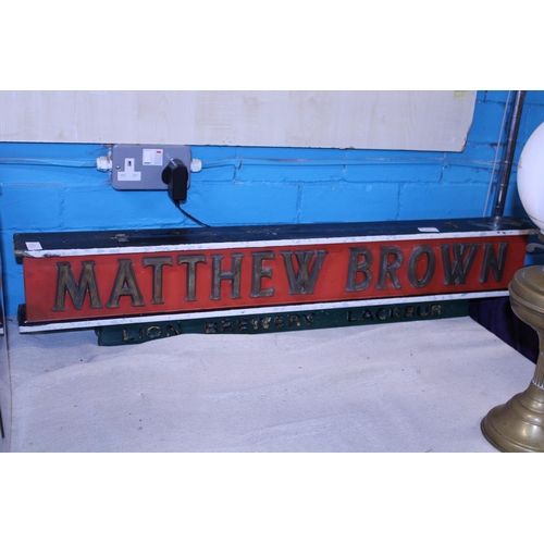 74 - A vintage Matthew Brown wooden hanging pub sign. Shipping unavailable