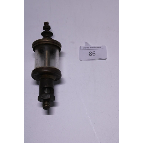 86 - A antique machine oiler