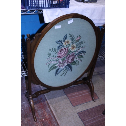 87 - A Edwardian oak firescreen with embroidered panel. Shipping unavailable