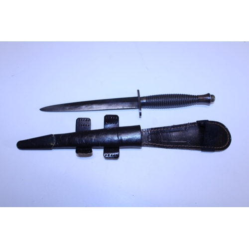 288 - A Fairbairn Sykes commando fighting knife pattern 3, No 1 to pommel (WW2 issue) and scabbard