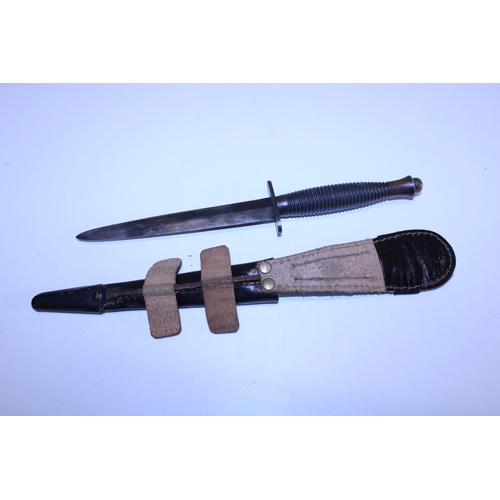 288 - A Fairbairn Sykes commando fighting knife pattern 3, No 1 to pommel (WW2 issue) and scabbard