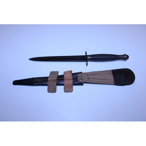 284 - A Fairbairn Sykes pattern 3 commando fighting knife, No 3 to pommel (WW2 issue) and scabbard