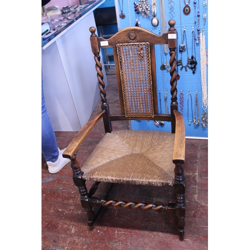 432 - A vintage light oak rocking chair with wicker work seat, shipping unavailable