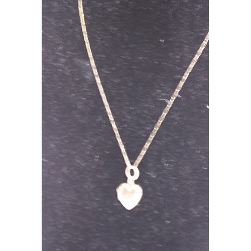 129 - A 9ct gold chain & locket. 3.78 grams