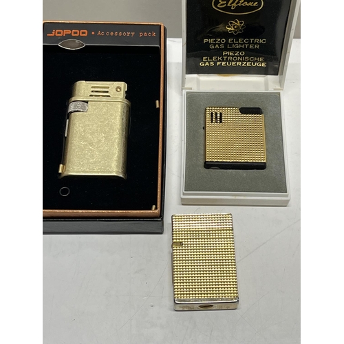 228 - Two boxed and one other vintage lighters