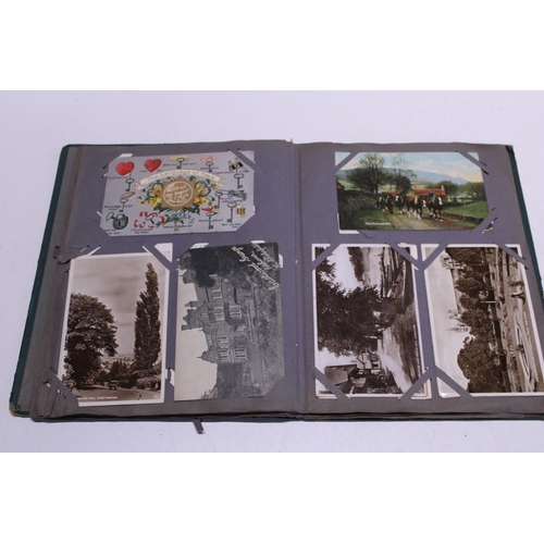 167 - A antique postcard album with good selection of assorted postcards