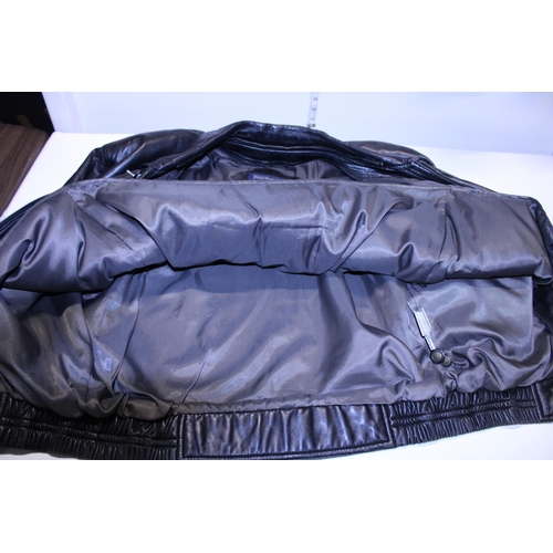 407 - A Yves Saint Laurent vintage leather jacket size 95? with additional detachable inner lining.