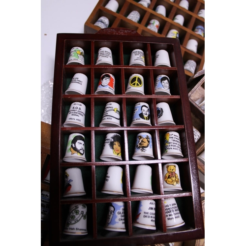 90 - A large selection of collectable thimbles and stands shipping unavailable