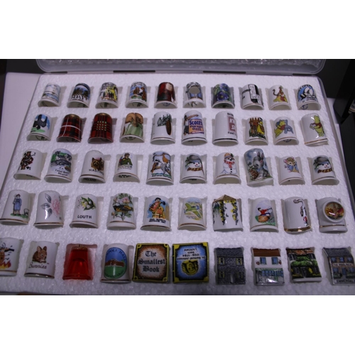 90 - A large selection of collectable thimbles and stands shipping unavailable