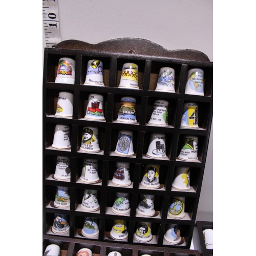 90 - A large selection of collectable thimbles and stands shipping unavailable