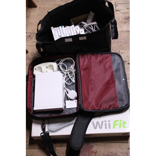 64 - A Wii console, Fit board accessories and games