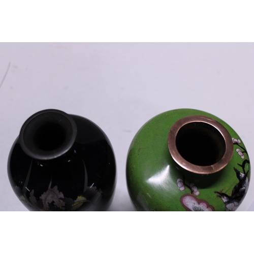 276 - Two Oriental enamelled vases  (black one with restoration)