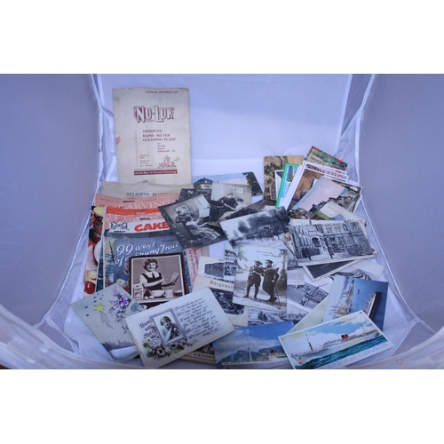 A selection of antique postcards and other ephemera