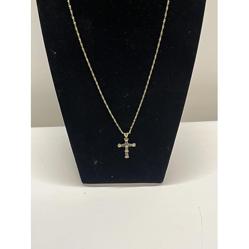 207 - A diamond and amethyst jewelled cross and chain