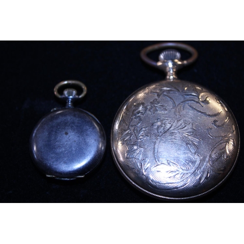 166 - A gold plated pocket watch and a ladies small white metal fob watch