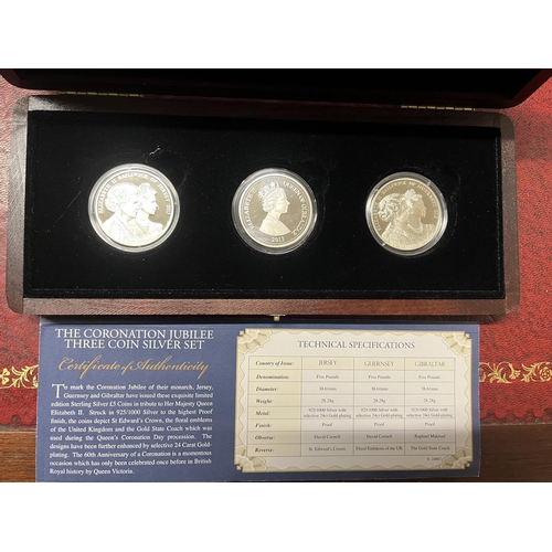 205A - A Westminster Coronation Jubilee three coin silver five pound proof set. Each coin weighs 28.28 gram... 