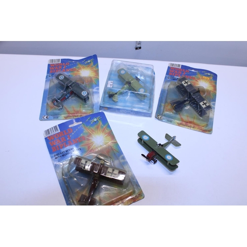 269 - Four boxed and several other military aircraft die-cast models