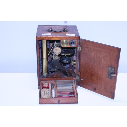 5 - A antique Victorian boxed brass microscope with alternate bullseye magnifier and accessories