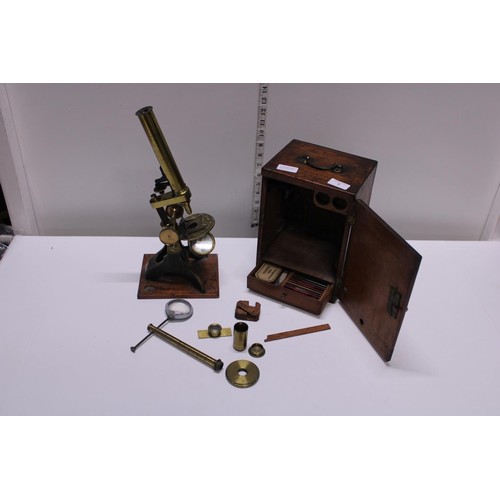 5 - A antique Victorian boxed brass microscope with alternate bullseye magnifier and accessories