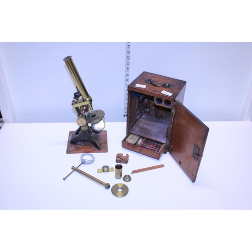 5 - A antique Victorian boxed brass microscope with alternate bullseye magnifier and accessories