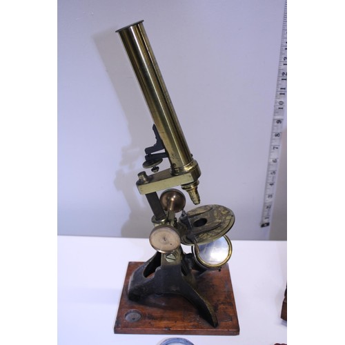 5 - A antique Victorian boxed brass microscope with alternate bullseye magnifier and accessories