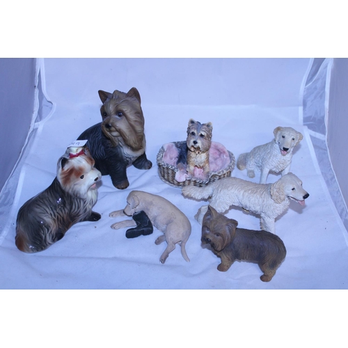 168 - A assortment of collectable dog figurines