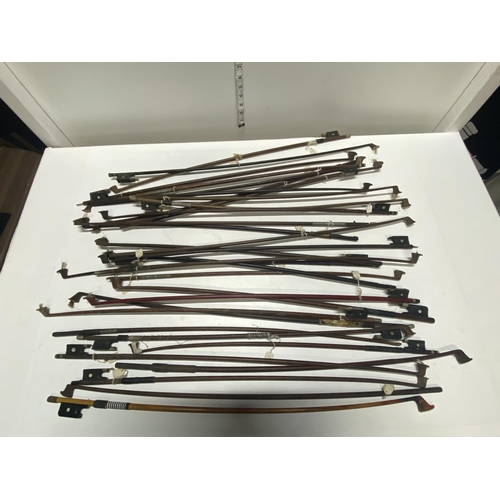 123 - A selection of antique violin bows