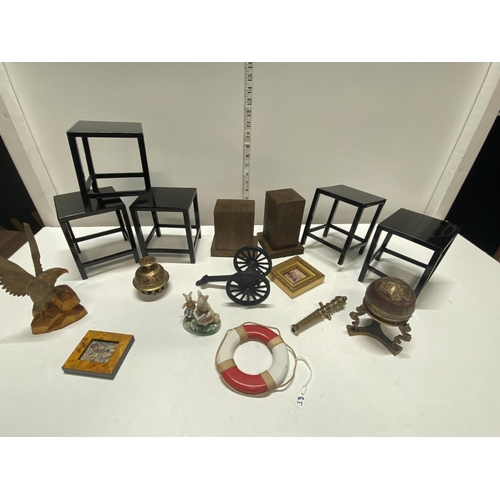 124 - A selection of collectibles including oriental stands and a model cannon