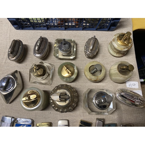 7 - A good selection of table lighters including onyx examples and Ronson